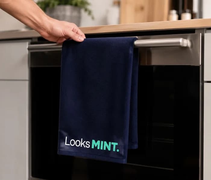 MINT branded tea towel on oven handle