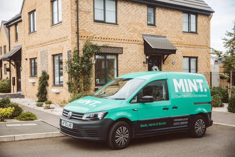 The MINT van parked outside a customer's home