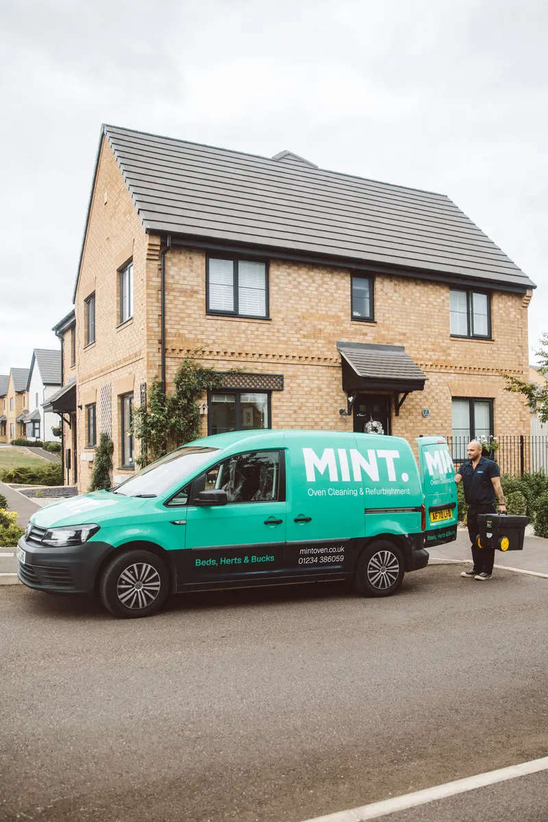 Taylor arriving with equipment beside the MINT van