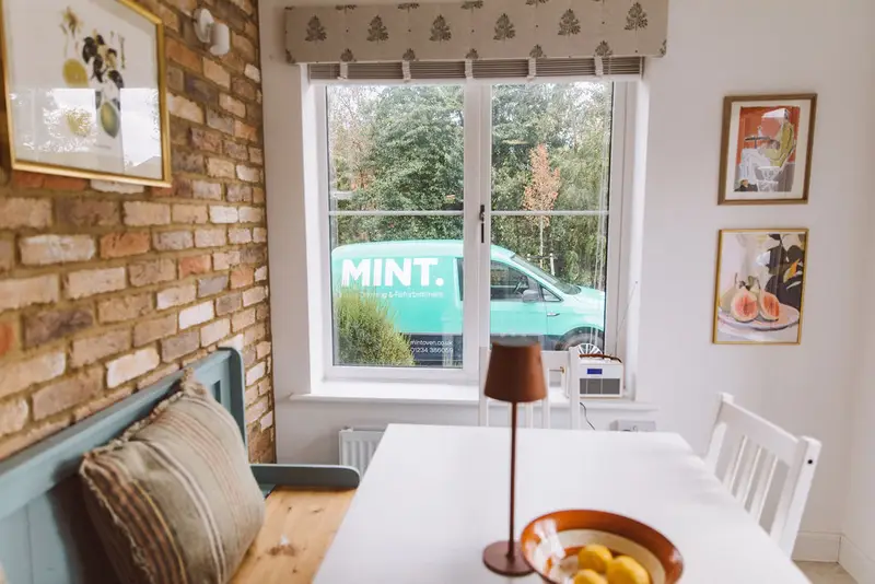 The MINT van seen through a customer's dining-room window
