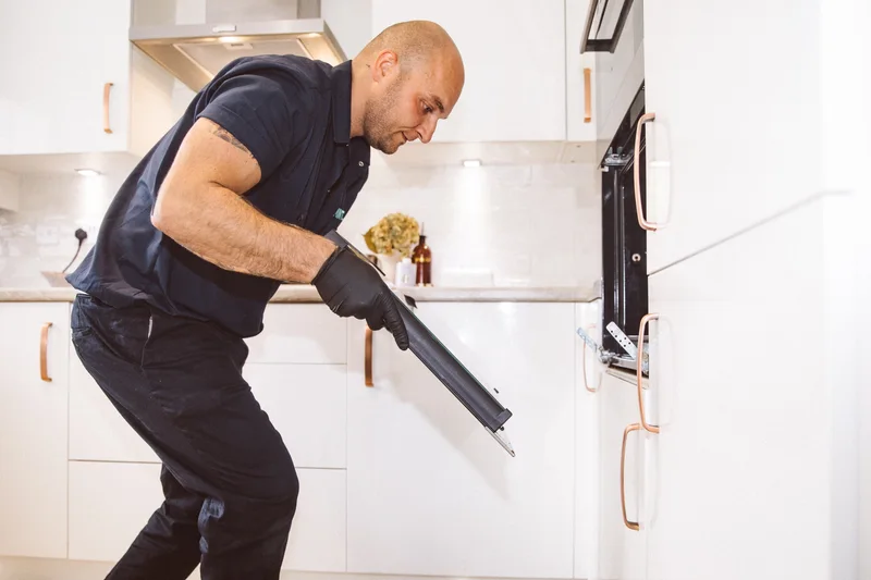 Taylor removing an oven door for cleaning