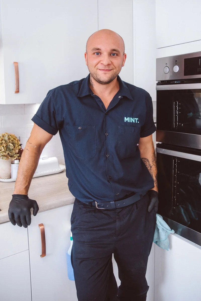 Taylor standing beside the oven after his work